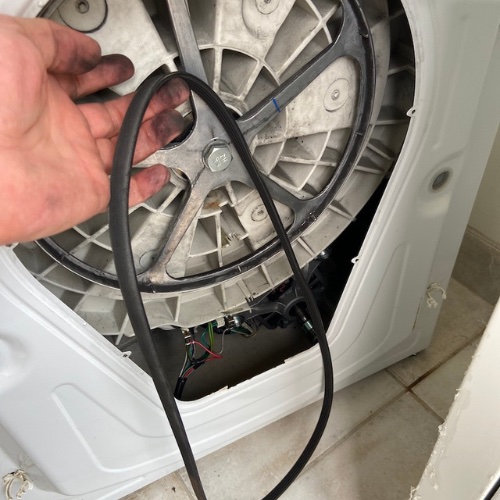 NWAR technician replacing a belt from a dryer, Bosch dryer needing fixing by a qualified technician