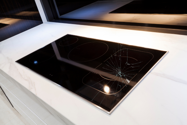 Cracked glass cooktop, needs professional technicians for repairs or replacement